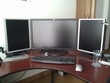 New HP ZR30w monitor flanked by two HP LP2065 monitors